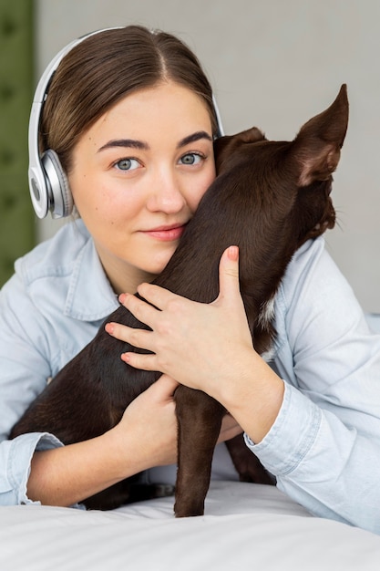 Free Photo close-up teenager hugging dog