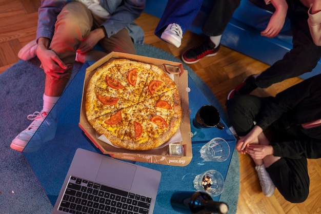 Close up teenagers with pizza