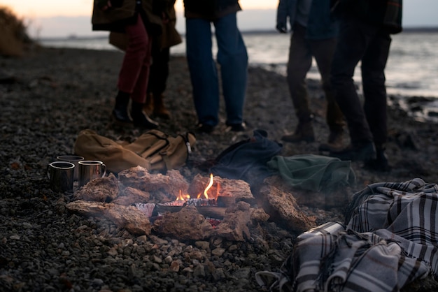 Close up teens outdoors with fire