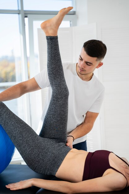 Close up therapist helping patient recover