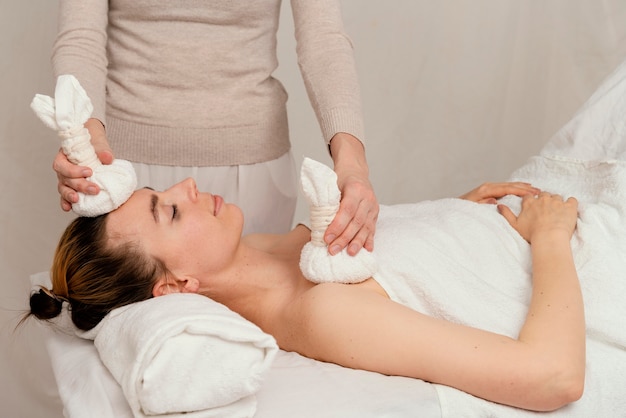 Close up therapist holding towels