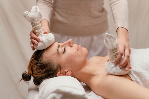 Free photo close up therapist holding wet towels