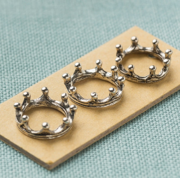 Free photo close-up of three silver crowns for epiphany day