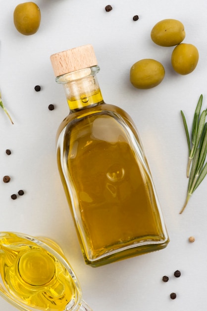 Free photo close-up top view bottle filled with oil on white background