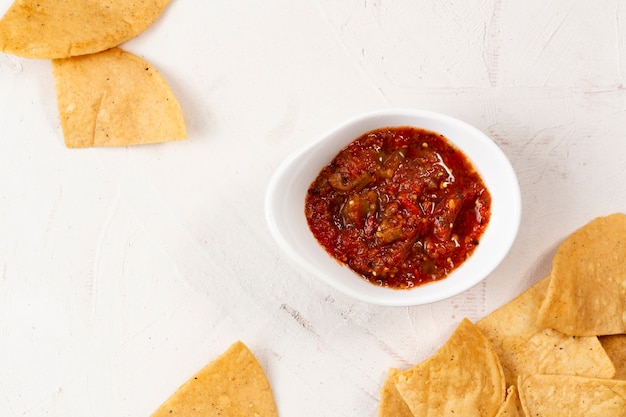 Free Photo close-up tortilla chips with spicy sauce