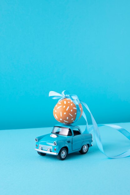 Close up on toy car with easter eggs