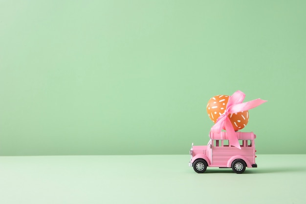 Free Photo close up on toy car with easter eggs