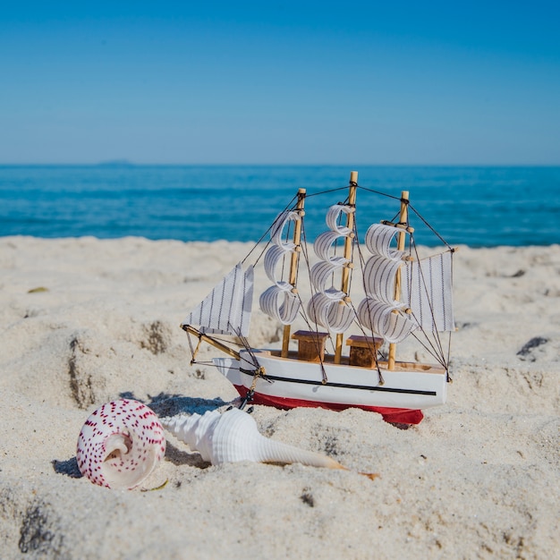 Free photo close-up of toy ship on sand