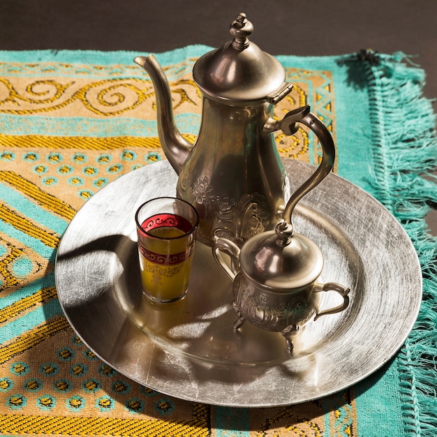 Close-up traditional arabic hot tea on prayer rug