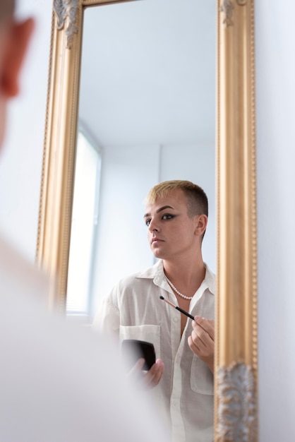 Close up transgender looking in the mirror