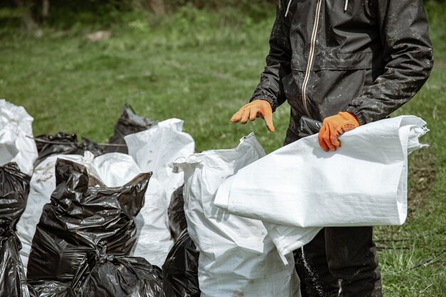 Close up of trash bags filled with trash after cleaning the environment.