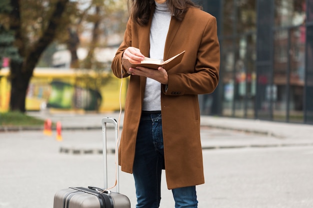 Free photo close-up traveler reading a book