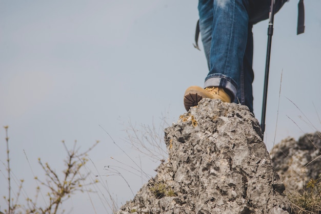 Free photo close-up of traveler on a rock