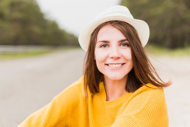 Close-up of traveling woman smiling