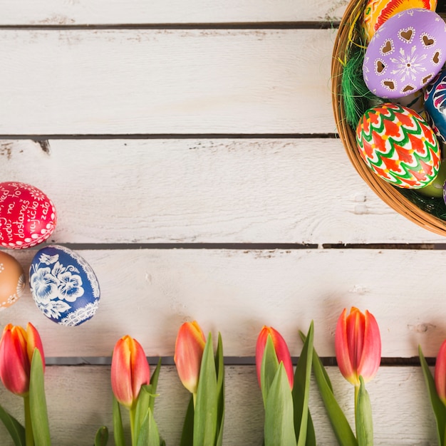 Free Photo close-up tulips and bright eggs