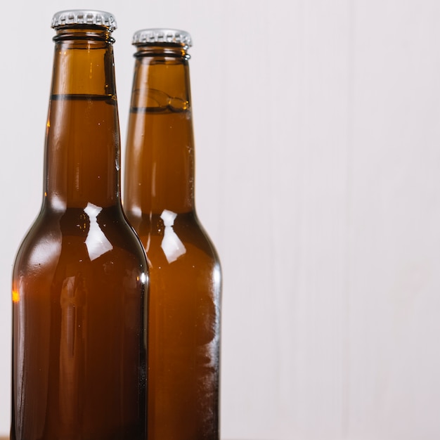 Close-up of two beer bottles