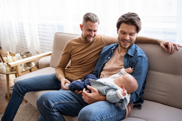 Close up on two dads and a baby