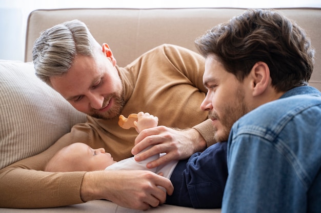 Free photo close up on two dads and a baby