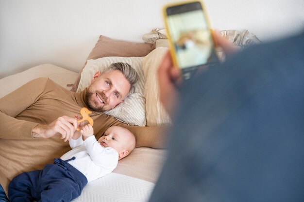 Close up on two dads and a baby