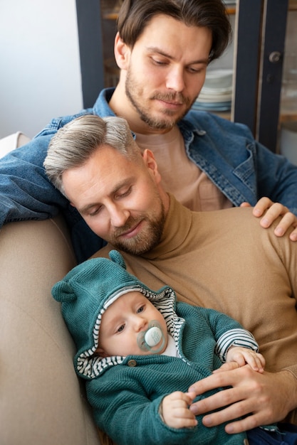 Free photo close up on two dads and a baby