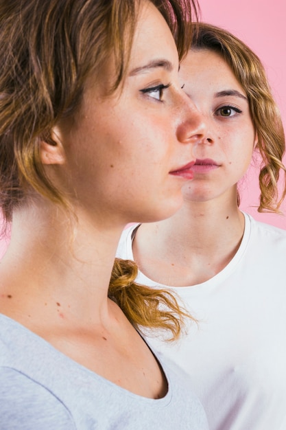 Free Photo close-up of two sister's face