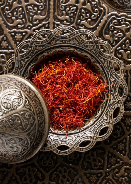 Close up on utensil full of saffron