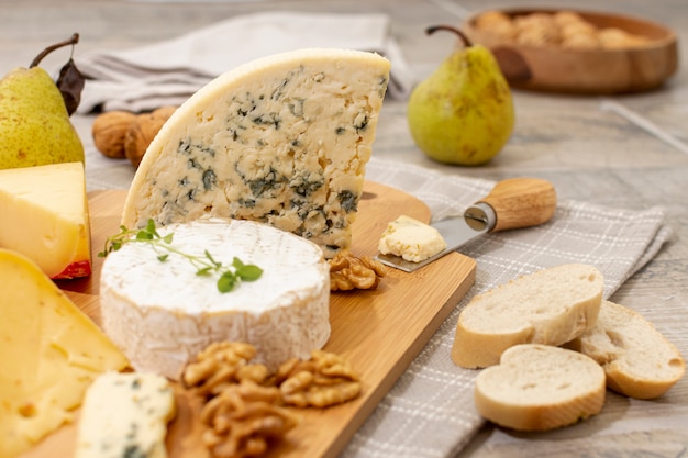 Free Photo close-up variety of cheese and fruits