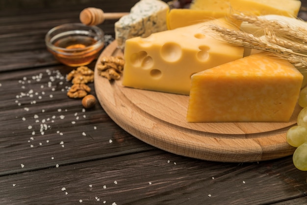 Close-up variety of cheese pieces on the table