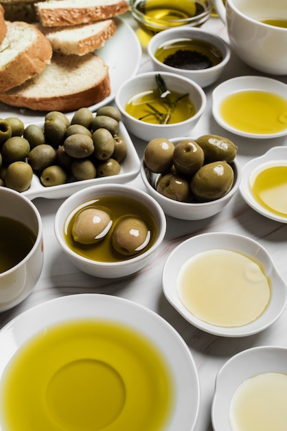 Close-up variety of olive oil and olives