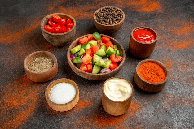 Free photo close up on various chopped vegetables in bowls