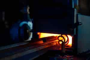 Free photo close up of various pieces of iron heating inside forge furnace burning fire with steel preparation of metal for processing