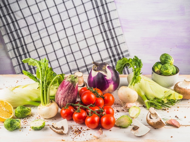 Close-up of various raw vegetables on wooden surface