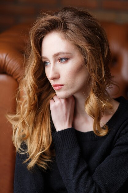 close up vertical portrait of young beautiful red haired woman.