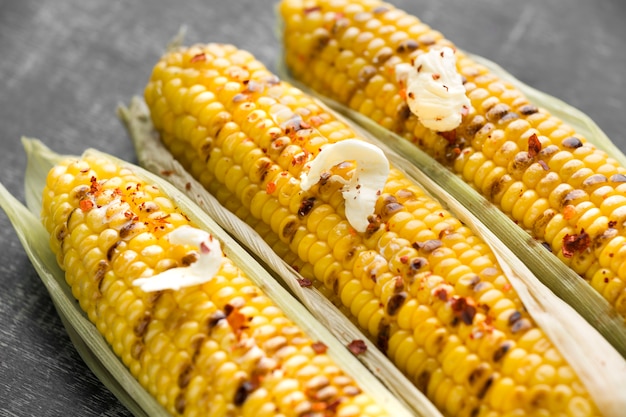 Close-up view of baked corn with butter