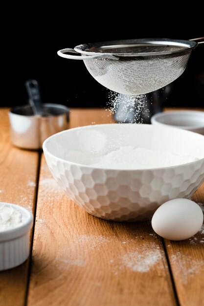 Close-up view of a bowl and sieve