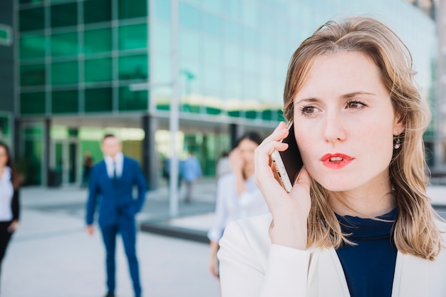 Close up view of businesswoman making a phone call