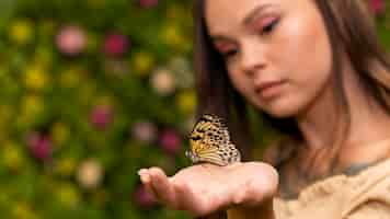 Free photo close-up view of butterfly on hand