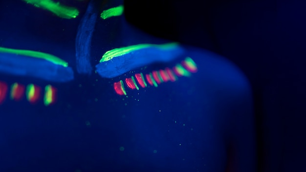 Free photo close-up view of colorful fluorescent make-up