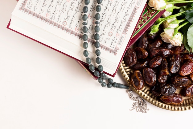 Close up view of dates and quran