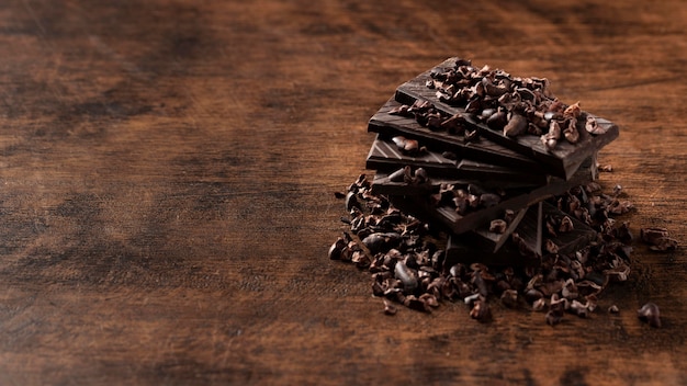 Free Photo close-up view of delicious chocolate on wooden table