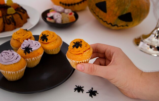 Close-up view of delicious halloween cupcakes