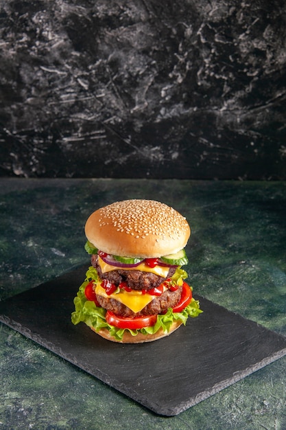 Free Photo close up view of delicious meat sandwich with tomatoes green on dark color tray on black surface with free space