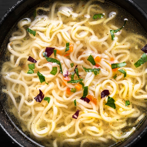 Close-up view of delicious noodles soup