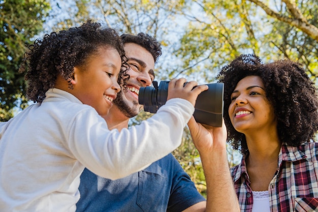 Close up view of family with binoculars