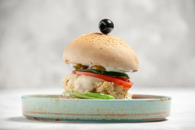 Free photo close up view of homemade delicious sandwich with black olive on a plate on stained white surface with free space