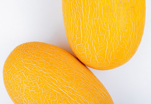 Close-up view of melons on white background