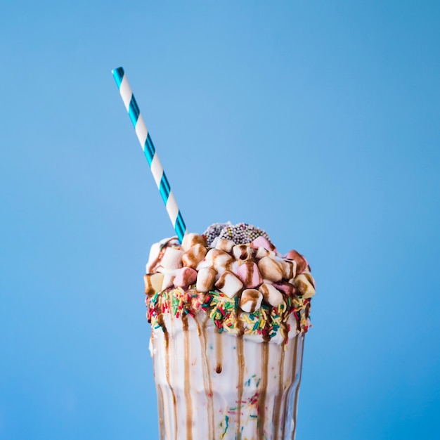 Close-up view of milkshake with marshmallow and chocolate topping