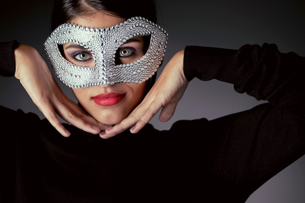 Free Photo close-up view of mysterious woman with carnival mask