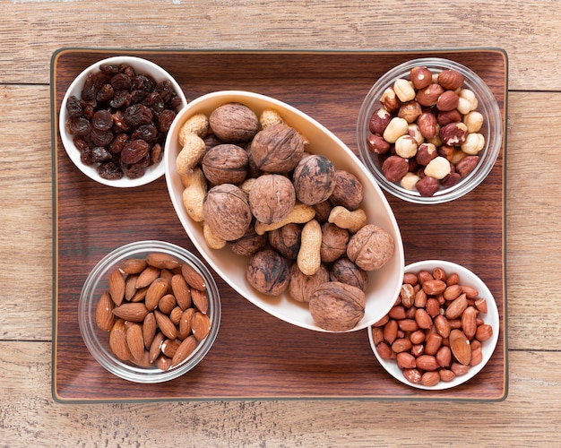 Free Photo close-up view of nuts arrangement on wooden table