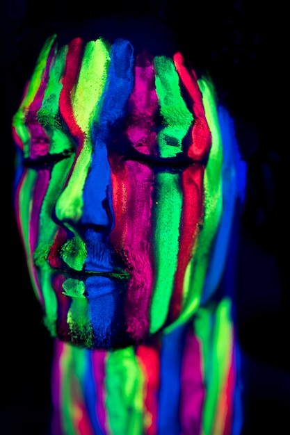 Free Photo close-up view of person with fluorescent make-up